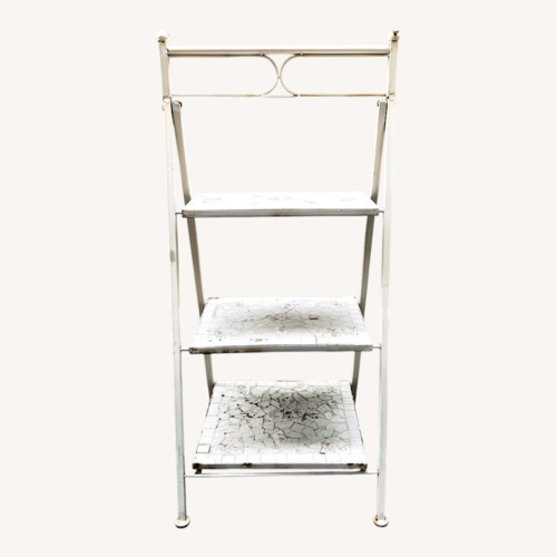 Used White Floral Metal Plant Display Stand Shelf for sale on AptDeco