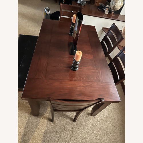 Used Dark Brown Wood Dining Set for sale on AptDeco