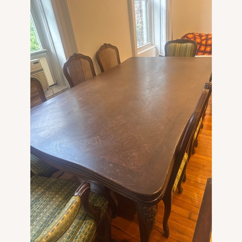 Used Dark Brown Wood Dining Table for sale on AptDeco