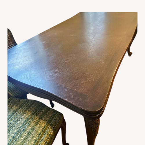 Used Dark Brown Wood Dining Table for sale on AptDeco
