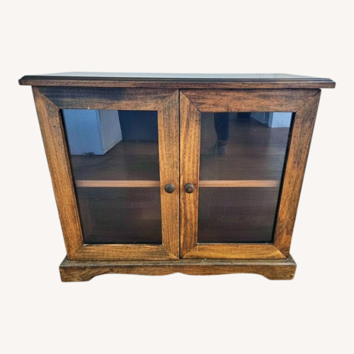 Used Compact 2-Door Wood & Glass Accent Cabinet for sale on AptDeco