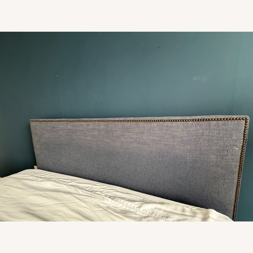Used West Elm White Bedframe with Blue Fabric Headboard for sale on AptDeco