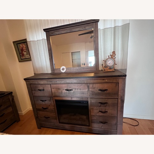 Used Armoire w Mirror and Electric Fireplace for sale on AptDeco