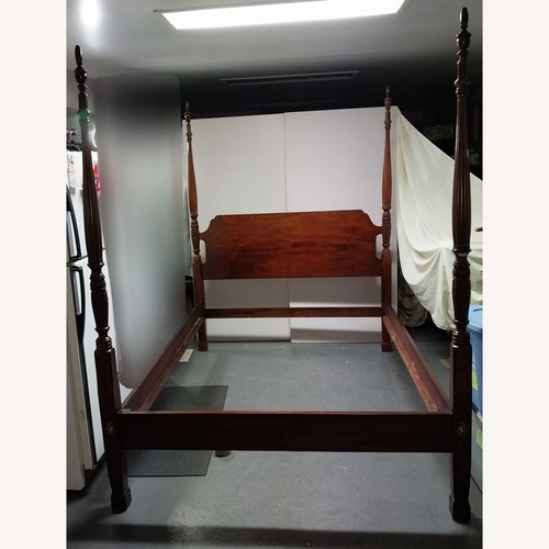 Used Dark Brown Wood 4 Post QueenBed for sale on AptDeco