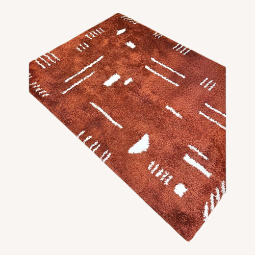 Used Orange Area Rug 4.4' x 6' for sale on AptDeco
