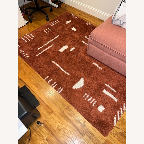 Used Orange Area Rug 4.4' x 6' for sale on AptDeco