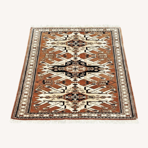 Used Traditional Patterned Area Rug Brown for sale on AptDeco