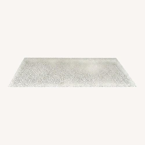 Used IKEA Vindum Modern Beige and Gray Speckled Rug for sale on AptDeco