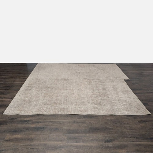 Used Large Beige Area Rug with Subtle Textured Pattern for sale on AptDeco