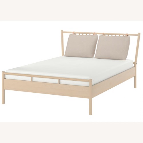 Used IKEA BJÖRKSNÄS Light Brown Wood King Bed for sale on AptDeco