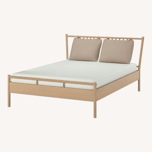 Used IKEA BJÖRKSNÄS Light Brown Wood King Bed for sale on AptDeco