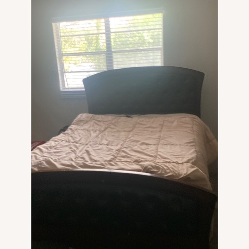 Used Dark Brown Wooden And Leather Bed for sale on AptDeco