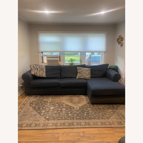 Used Bob’s Discount Navy Pull Out Sofa with Chaise for sale on AptDeco