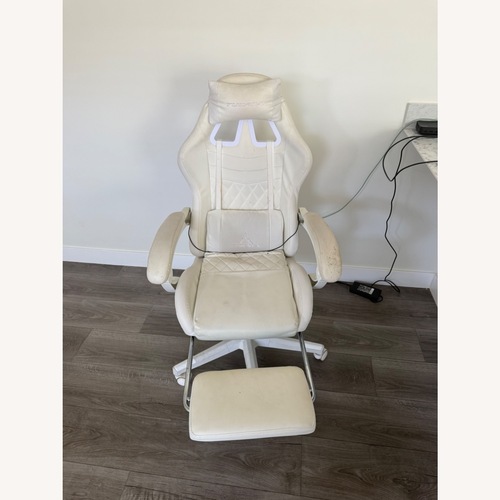 Used  Large Racing-Style Gaming Chair with a Footrest and Massager for sale on AptDeco