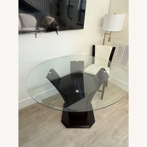 Used Raymour & Flanigan Venice Dark Brown Glass Dining Table for sale on AptDeco