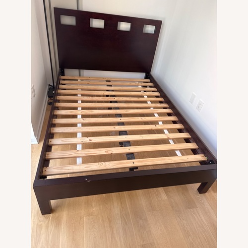 Used Dark Brown Wood Full-Size Bed for sale on AptDeco