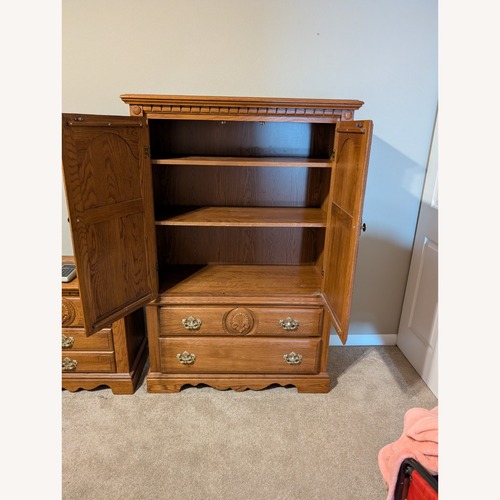 Used Vintage/Antique Natural Wood Armoire for sale on AptDeco
