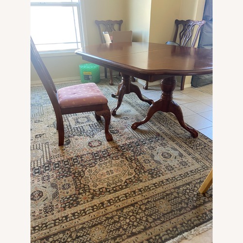 Used Dark Brown Wood Dining Set for sale on AptDeco