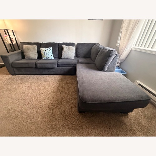 Used Blue Fabric 2 Piece Sectional (Pillows Included) for sale on AptDeco