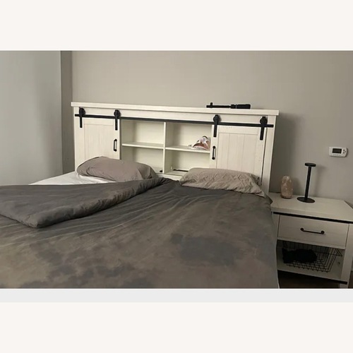 Used Bob's Discount King Bed with Bookshelves and Storage  for sale on AptDeco