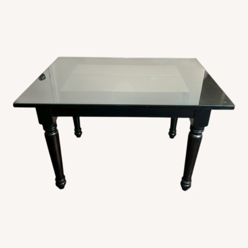 Used Black Wood Dining Table for sale on AptDeco