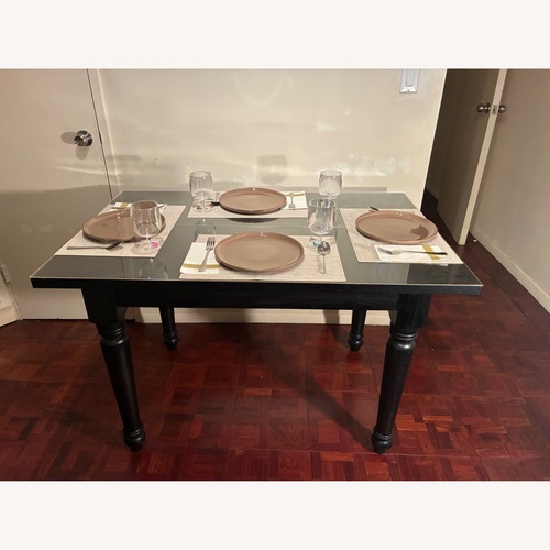 Used Black Wood Dining Table for sale on AptDeco