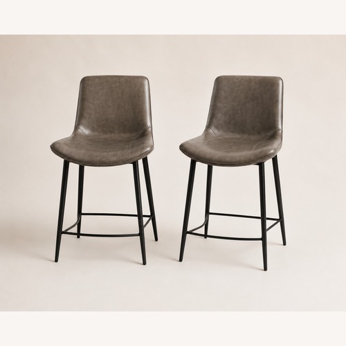 Used Arhaus Dark Gray Faux Leather Stools for sale on AptDeco