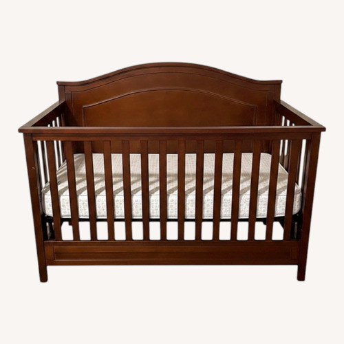 Used Dark Brown Wood Crib for sale on AptDeco
