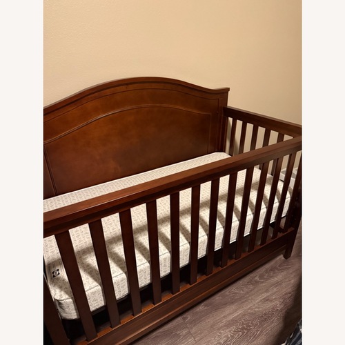 Used Dark Brown Wood Crib for sale on AptDeco