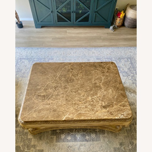 Used Champagne Marble Top Coffee Table for sale on AptDeco