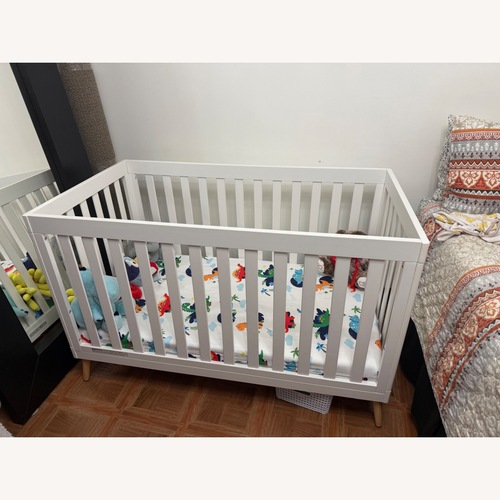 Used Delta Children White Wood Crib for sale on AptDeco