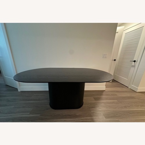 Used Black Wood Dining Table for sale on AptDeco