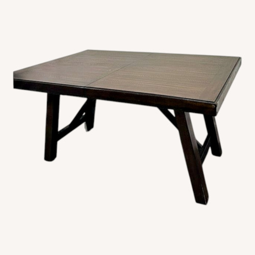 Used Raymour & Flanigan Dark Brown Wood Dining Table for sale on AptDeco