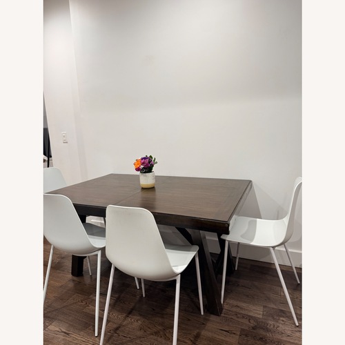 Used Raymour & Flanigan Dark Brown Wood Dining Table for sale on AptDeco