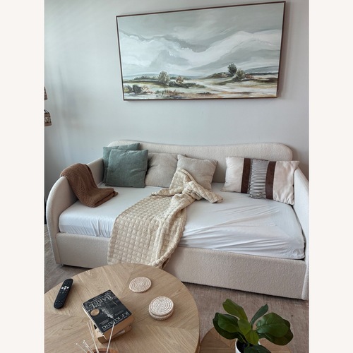 Used Orrin Boucle Curved Daybed with Hydraulic Storage for sale on AptDeco