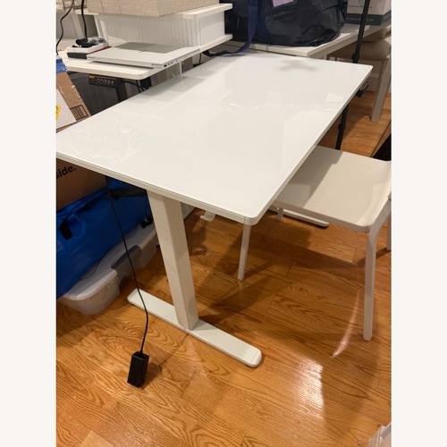 Used White Glass Top Standing Desk for sale on AptDeco