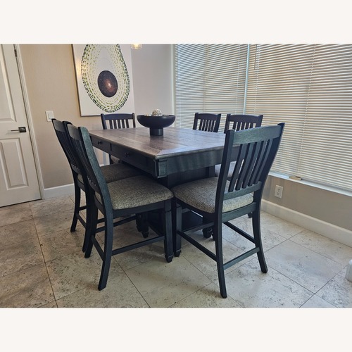 Used Dark Brown Wood Dining Set for sale on AptDeco