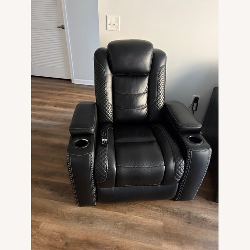 Used Ashley Black Power Recliner with Adj Headrest for sale on AptDeco