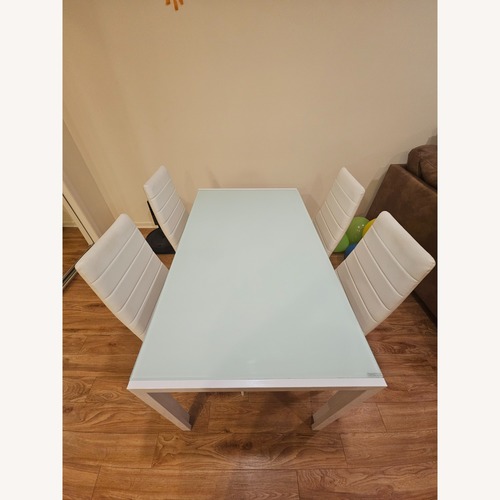 Used White Glass Top Table 4 Chairs for sale on AptDeco