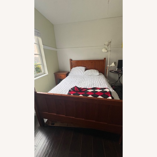 Used Pottery Barn Solid Wood Bed Frame for sale on AptDeco