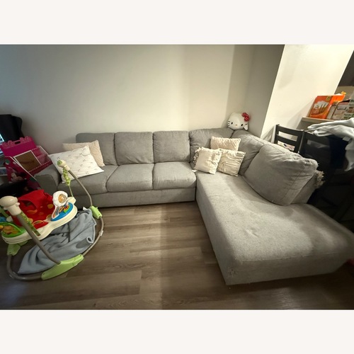 Used Living Spaces Mcdade Light Gray Fabric 2 Piece Sectional for sale on AptDeco