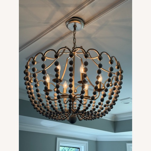 Used Champagne Silver & White Wood Bead Chandelier for sale on AptDeco