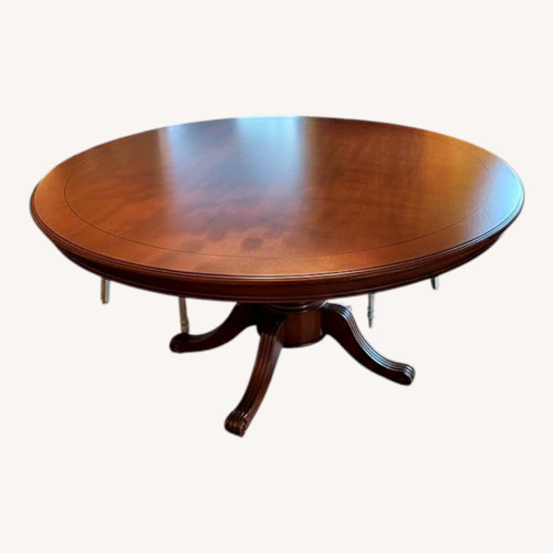 Used Dark wood 72” Round Table for sale on AptDeco