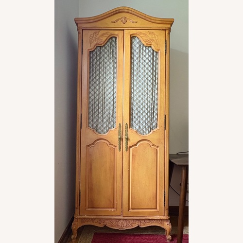 Used Vintage/Antique Finds Light Brown Wood Armoire for sale on AptDeco