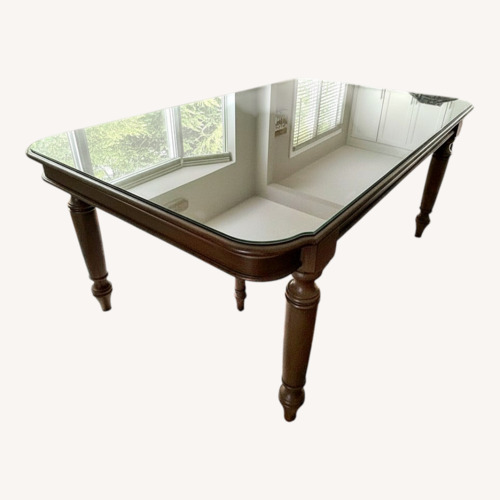 Used Dark Brown Wood Dining Table for sale on AptDeco