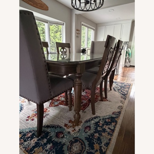 Used Dark Brown Wood Dining Table for sale on AptDeco