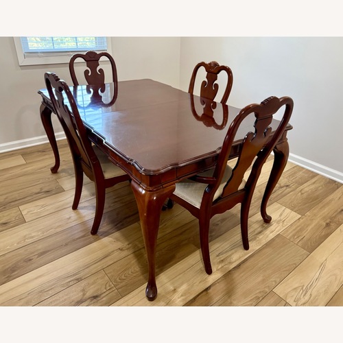 Used Dark Brown Wood Dining Set for sale on AptDeco