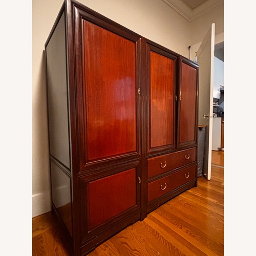 Used Dark Brown Wood Armoire for sale on AptDeco