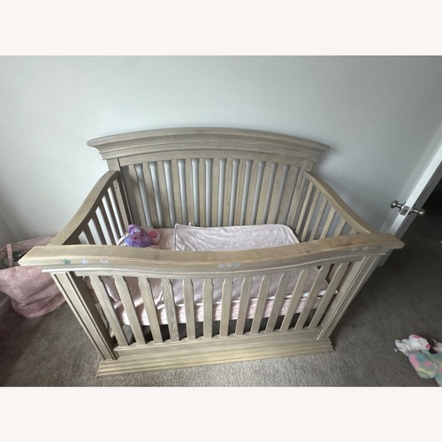 Used Light Brown Wood Crib for sale on AptDeco