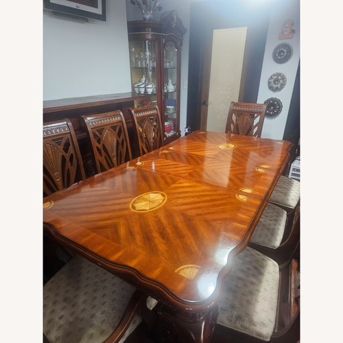 Used Dark Brown Wood Dining Table for sale on AptDeco